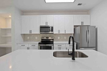 Hand-selected italian backsplash and quartz countertops